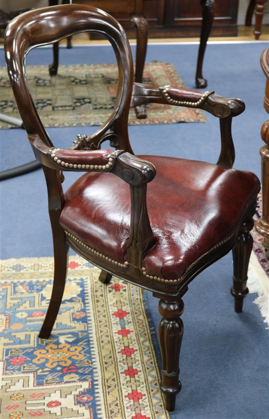 A set of nine Victorian style mahogany balloon-back open armchairs